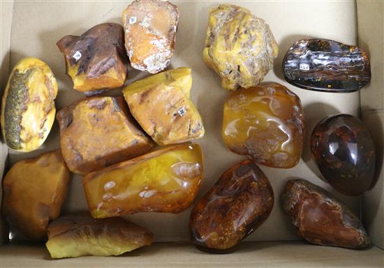 Fourteen assorted pieces of raw amber.